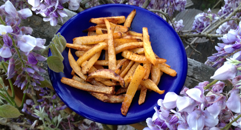 Oven-baked rutabaga fries -- set amidst the wisteria on my deck